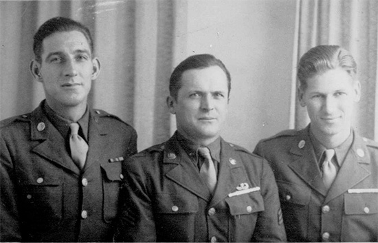 Private First Class Roger K. Powell (L), ASN 35425054, and 2 unidentified members of the 326th Airborne Medical Company. Photo taken at the end of the war. (Pfc R. Powell was killed in Normandy 8 June 1944, and is buried in the Normandy American Cemetery). Photo courtesy Cindy Ball.