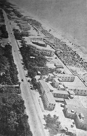 Aerial view taken from a Piper Cub showing the buildings comprising the 33d General Hospital at Livorno (Leghorn), Italy. West of the location was a beach and east of the site a dense wood. Photo taken during the unit's stay, October 1944 - September 1945.  