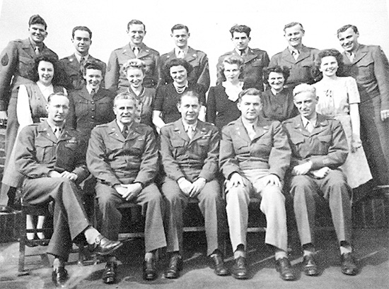 Group photo illustrating 5 Chaplains (front row) taken while training in Southern England (SBS) prior to D-Day. This particular photo belonged to a group depicting 29th Infantry Division personnel stationed in the United Kingdom. Courtesy Pieter Oosterman