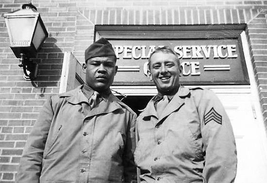 Photograph of Joe Louis (aka the Brown Bomber) and Sergeant Henry M. Robbins, ASN 33391765 (Second Platoon). Photo probably taken in the United Kingdom, which the world heavyweight champion visited in April and May 1944. Courtesy John D. Little.