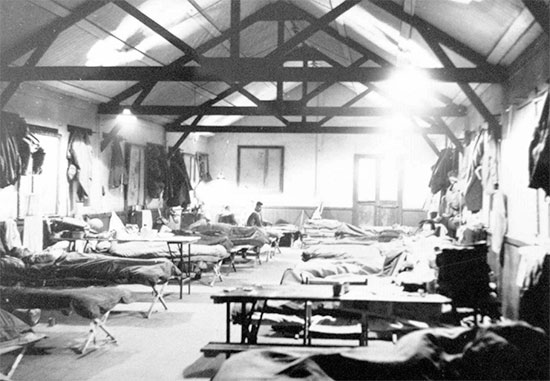 Camp C-5, internal view of Officers’ barracks, Westminster, England, before crossing over to France, 23 March 1945.