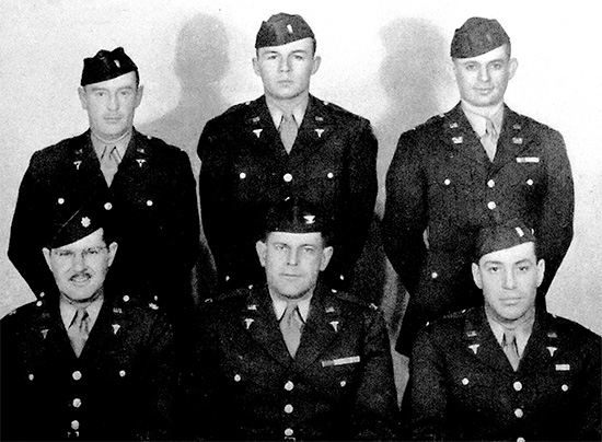 Officers of the 15th General Hospital pertaining to the unit’s Headquarters Group. Photo illustrating Colonel John P. Bachman, MC (CO); Lt. Colonel Martin R. Krausz, MC (XO); First Lieutenant Daniel R. Prosnit, MAC (Adjutant); First Lieutenant Raymond E. Barnett, MAC; First Lieutenant Dean H. Orem, MAC; and Chief Warrant Officer Andrew M. Orr. Photo taken at Fort Dix, Wrightstown, New Jersey, Zone of Interior.