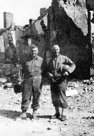 48th Field Hospital personnel. Sergeant Ralph L. Quesinberry (L) and Captain John C. Petrone (R), CO, First Platoon, in Saint-Lô, France.