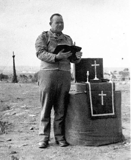 Capt. George F. Hood, (Protestant Chaplain) conducts a service for the personnel of the 45th General Hospital during the bivouac at "Goat Hill"