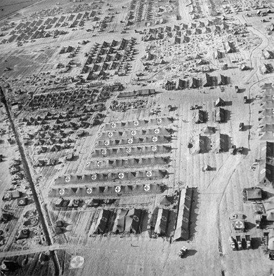 Aerial view of Anzio beachhead, illustrating the American hospital sector. All installations are packed together and clearly identified by numerous GC symbols.