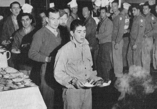 Enlisted Men enjoy a hot meal at the 26th's facility in Bari, Italy. 