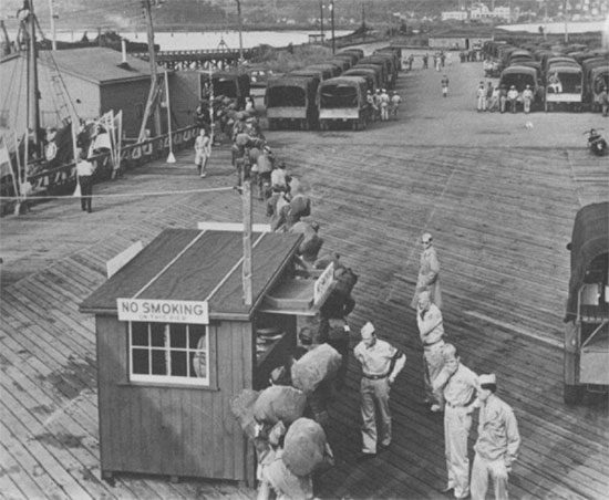 Partial view of Piermont Pier. Located on the west bank of the Hudson River, this was the principal embarking point of GIs heading for the European Theater. The soldiers were usually marched from nearby Camp Shanks, Orangeburg (Staging Area for NY POE) to the end of the pier where ships were waiting to take them overseas. After the war, over half a million men returned home, setting foot back in the US across the same pier. This is also the pier from where the SS “Pasteur” troop ship left for overseas.