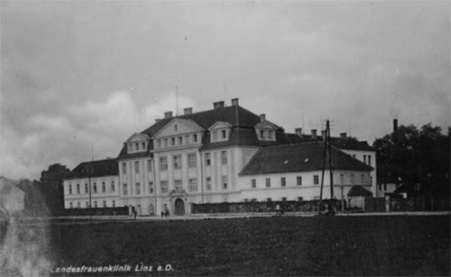 Exterior view of the Landesfrauenklinik, a former civilian hospital in Linz, Austria which housed the 117th Evacuation Hospital during its final months of overseas operations. 