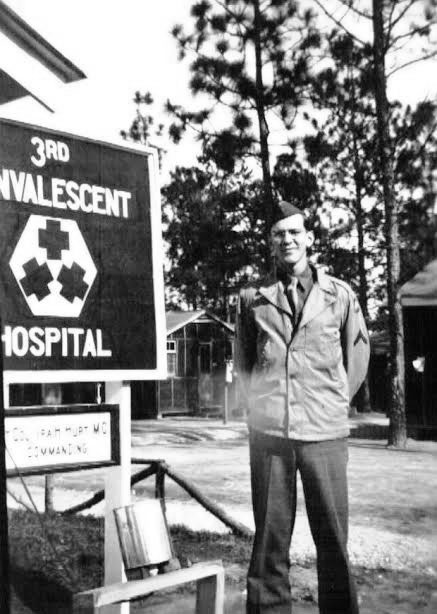 Picture of Private First Class Ralph K. Sellers at Camp Livingston, Alexandria, Louisiana (AGF Training Station and Reception Center where the 3d Convalescent Hospital was stationed, please see signpost). Pfc Sellers entered into active service at Camp Perry, Ohio, 22 September 1942, from where he was most probably transferred to Camp Livingston as a member of the cadre which helped form and increase the newly-activated 4th Convalescent Hospital. Picture taken in 1943.