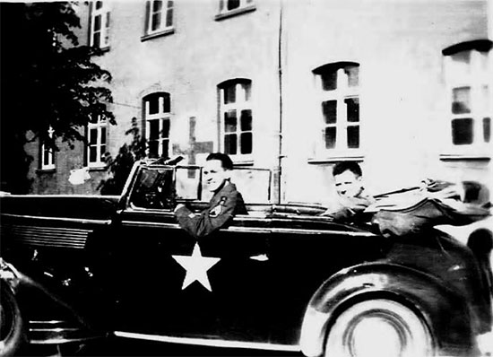 Staff Sergeant Ralph K. Sellers driving a German ‘booty’ car while stationed in Arolsen, Germany. Picture taken 4 June 1945.