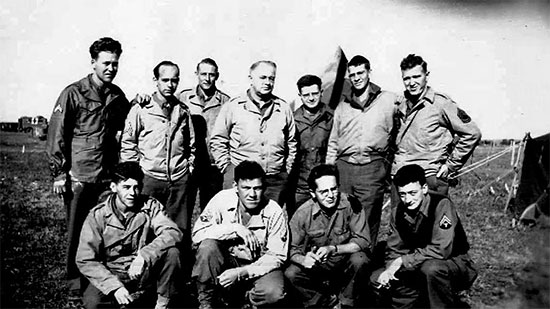 Group picture of 4th Convalescent Hospital personnel while training at Camp McPherson, Atlanta, Georgia. The Reception Center had an overall acreage of 371 and a capacity for 335 Officers and 5,917 Enlisted Men. Captain D. Waller (fourth from L back row) surrounded with the following Enlisted personnel; Vernon Nolte, Wappler, Burkeen, Bryson, Ralph K. Sellers, Jim Durbin, Gerrit Van Noorloos, Powell, Francis Felke, and Armstrong. Picture taken some time in 1943.