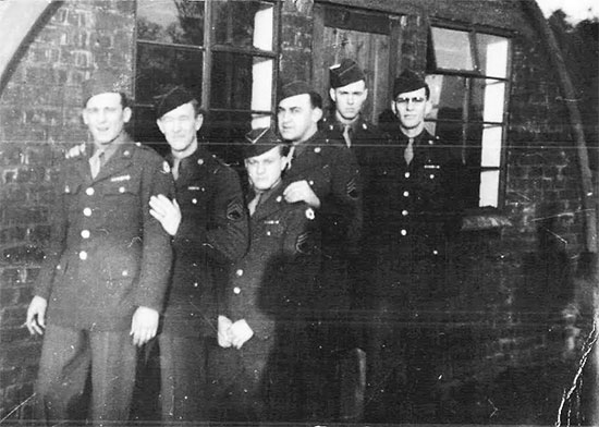 Picture illustrating some Enlisted Men of the 4th Convalescent Hospital, standing in front of a Nissen hut (location unknown). It appears to have been taken later during the war, as the men’s uniform coats are adorned with medal ribbons ... the building seems reminiscent of the ones constructed in the United Kingdom ... From L to R: Nick DeBerdanint, Grady White, Bill Pointer, Herb Singertot, Murl Skaggs, and Ralph K. Sellers.