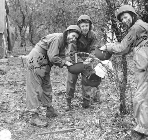 Nurses of the 12th Field Hospital during training at Camp Bowie, Texas. From L to R: 2d Lieutenant Nola A. Thompson; 2d Lieutenant Sevilla N. Durkop; and 2d Lieutenant Mary J. Maegerlein. Photo taken 15 March 1943.