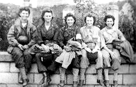 A group of ANC Officers enjoy a rest, while smiling at the camera. Germany 1945.