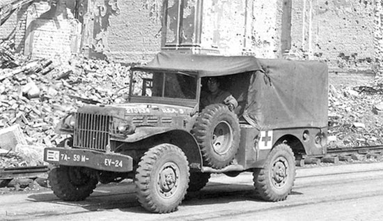 European Theater early 1945. A 3/4-ton weapons carrier (WC-52 type) converted for use, either as an ambulance for evacuating casualties, or just for hauling medical supplies, or transporting personnel (this particular vehicle belongs to the 59th Evacuation Hospital).