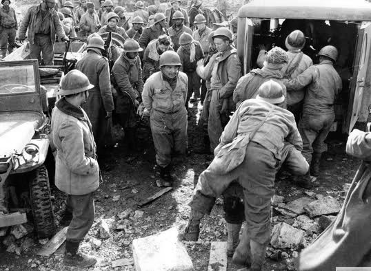 1944; somewhere in Italy. Wounded French soldiers are evacuated by 3/4-ton ambulance to the nearest Hospital for treatment.