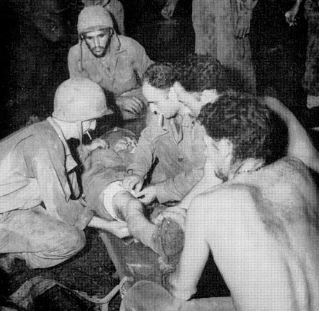 July 1943; Aid Station established in the jungle on Rendova Island, where casualties received the necessary basic treatment prior to evacuation to a Hospital for further care.