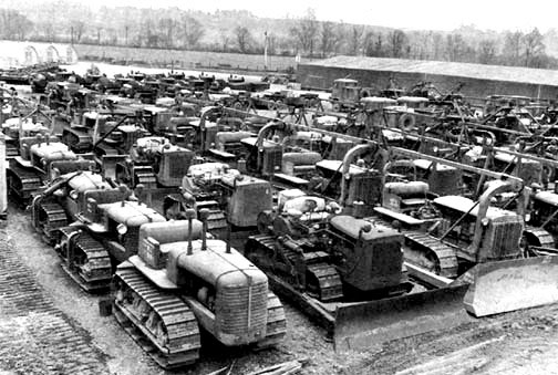 US Forces build-up in the United Kingdom. Outside depot in the country illustrating miscellaneous types of bulldozers. 