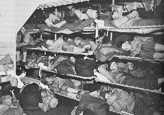 Vintage photo illustrating the Enlisted Men’s accommodation aboard US military transports during the war. Note the many tiers and the limited space.