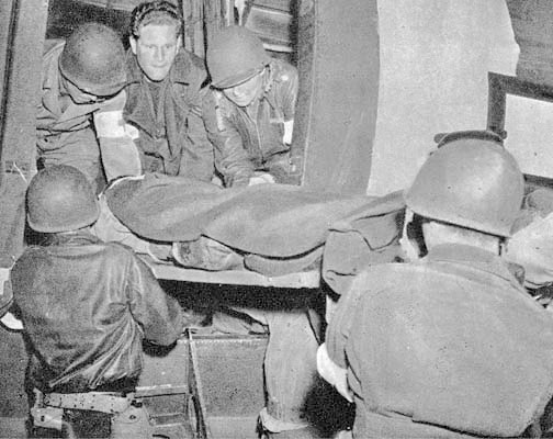 22 May 1943. Air Evacuation out of Tunisia. A litter patient is loaded aboard a converted C-47 cargo plane. The standard chain of evacuation from the battlefields in Tunisia went by road and rail, while air evacuation took the patients directly to fixed Army Hospitals in Algiers and in the vicinity of Oran, both in Algeria. Medical units were often exclusively used as holding units for air evacuation or to serve personnel of an Allied air base. The First and Second Hospitalization Units of the 10th Field Hospital served as a holding unit at Souk-el-Arba, Tunisia, preparing patients for air evac from Tunisia to Algeria (period 16 January 1943 – 23 May 1943).