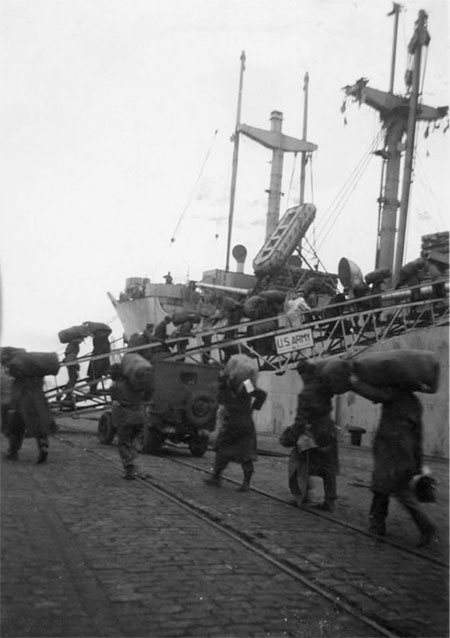 Unidentified American troops board the USAT John Ericsson, the transport that carried the 10th Field Hospital to French Morocco early March 1943. 