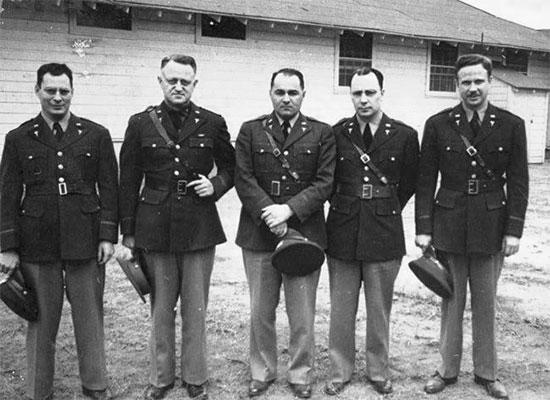 A number of Medical Officers of the 21st General Hospital, while in training at Fort Benning, Georgia, March-September 1942. From L to R: Major Leo Gottlieb, Lieutenant Colonel Lee D. Cady, First Lieutenant Henry P. Lattuada, Major Virgil O. Fish, Major Truman G. Drake, Jr.