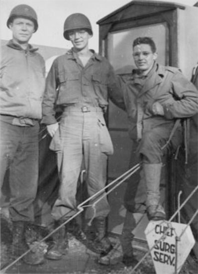 From L to R: Picture illustrating Major Jean M. Stevenson; Sergeant Joe L. Parson; and Private Charles E. Batch, while serving at Lison, France, during summer of 1944.