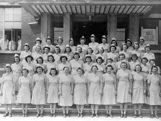 Group of ANC Officers of the 25th General Hospital, in front of the main building occupied by the unit at Tongres, Belgium.