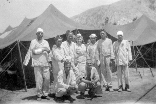 Group of Nurses and patients at Maddaloni, Italy. The 27th Evacuation Hospital operated a tented hospital where they mainly treated French and French colonial troops, between late May and early August 1944.