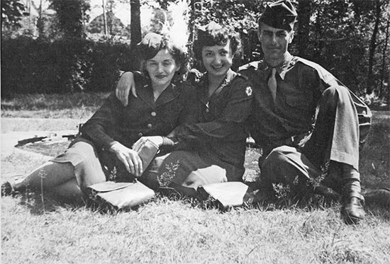 Second Lieutenant Olga A. Petza and another unidentified Nurse and Officer of the 101s General Hospital relax in their Class A uniforms somewhere in Europe. Courtesy of Richard Rell.