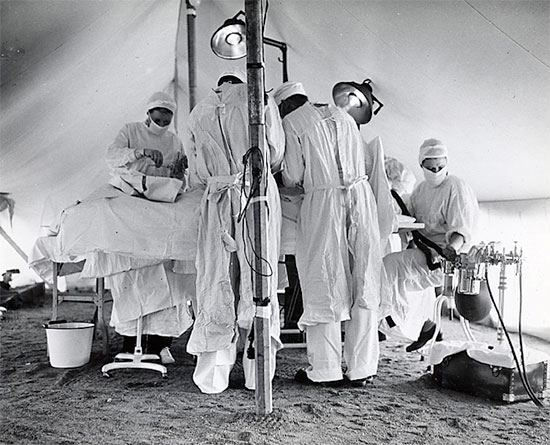 Colonel Charles B. Puestow, Commanding Officer, 27th Evacuation Hospital conducting an operation. It looks like the OR is set up in a tent, but the site is unfortunately not identified. Courtesy UIC.