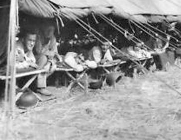 Picture illustrating a number of patients after triage, enjoying some rest while awaiting further treatment. Picture taken either at Maddaloni, Italy, or at Bouc-Bel-Aire, Southern France.