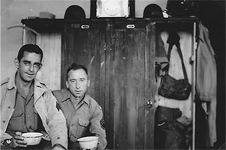 Sgt. James Mooney and S/Sgt. Harry Parker pose for the camera in their barracks