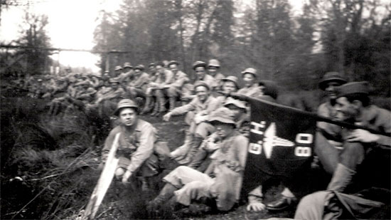 Training in the Zone of Interior. Men take a break during one the hikes (of interest is the Hospital’s guidon at right).