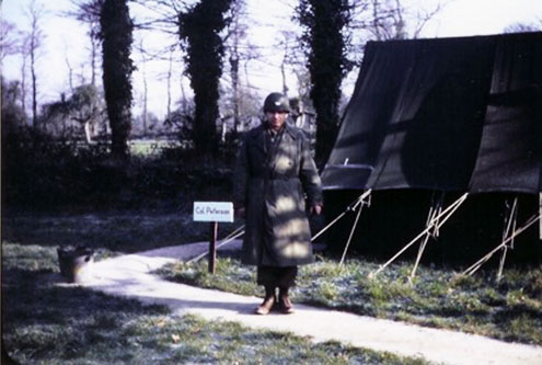 Picture of Colonel Walter L. Peterson, MC, O-18292, Commanding Officer, 189th General Hospital (in front of his canvas quarters, Lison, France, November 1944).