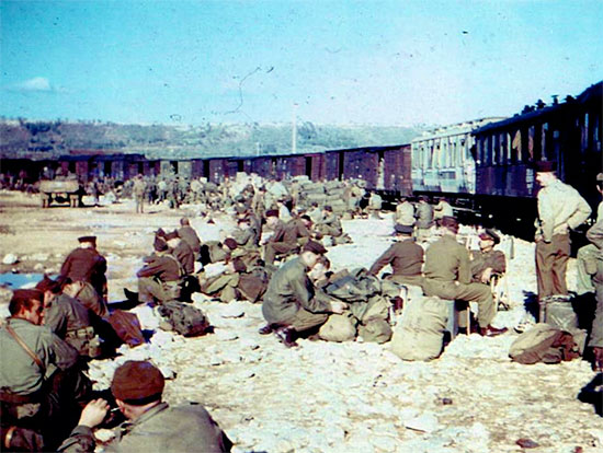 Picture illustrating personnel of the 189th General Hospital during a break. The men are on their way by train to the Calas Staging Area, Southern France, for redeployment ...