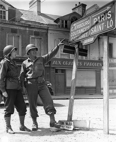 Unidentified Officer and Nurse pictured in Carentan, France. 