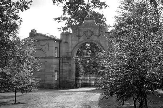 Photograph showing the main gatehouse at Oulton Park, the 50th General Hospital's first home in the United Kingdom.